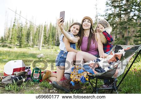 Mother with son (6-7) and daughter (8-9) camping in forest View Large Photo Image Stock Photo - Mother with son (6-7) and daughter (8-9) camping in forest. Fotosearch