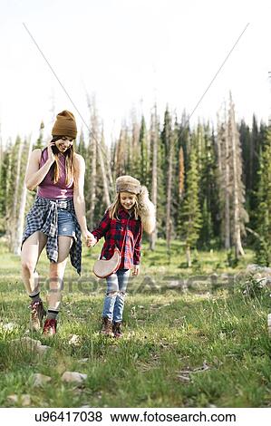 Mother with son (6-7) hiking in forest View Large Photo Image Stock Photo - Mother with son (6-7) hiking in forest. Fotosearch