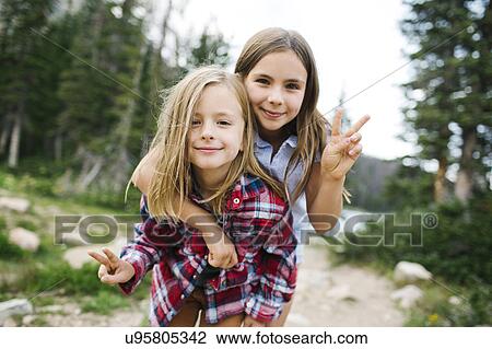 Outdoor portrait of brother (6-7) and sister ( 8-9) in forest View Large Photo Image Stock Image - Outdoor portrait of brother (6-7) and sister ( 8-9) in forest. Fotosearch