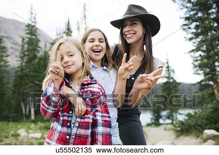 Outdoor portrait of mother with kids (6-7, 8-9) in forest View Large Photo Image Stock Photography - Outdoor portrait of mother with kids (6-7, 8-9) in forest. Fotosearch