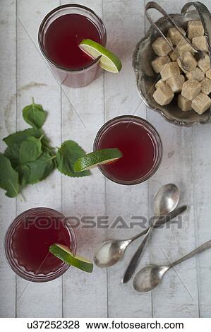 Stock Photo - Overhead view of fresh tea with lime and mint. Fotosearch