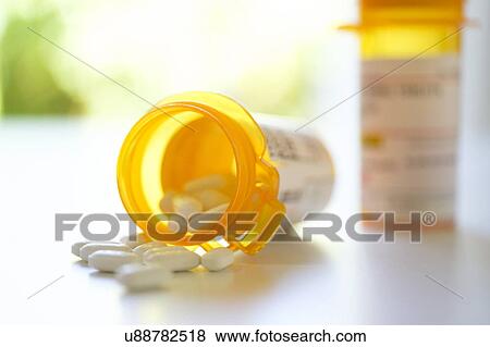 Stock Photo - Pill bottles on table. Fotosearch