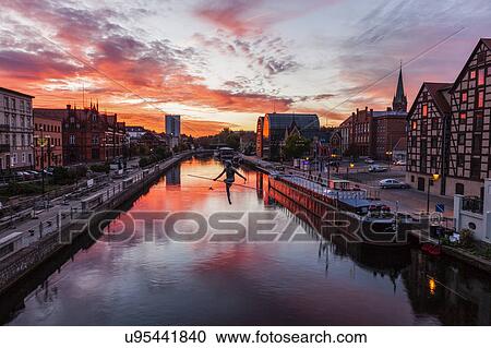 Poland, Kuyavian-Pomeranian, Bydgoszcz, Brda River, Dramatic sky reflecting in water surface View Large Photo Image Stock Image - Poland, Kuyavian-Pomeranian, Bydgoszcz, Brda River, Dramatic sky reflecting in water surface. Fotosearch