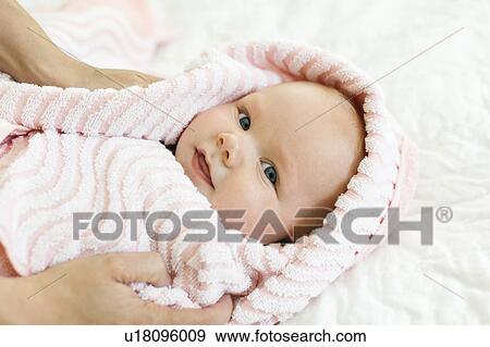 Portrait of baby boy (12-17 months) in pink blanket View Large Photo Image Stock Photo - Portrait of baby boy (12-17 months) in pink blanket. Fotosearch