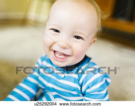Picture - Portrait of baby boy (12-17 months) smiling. Fotosearch