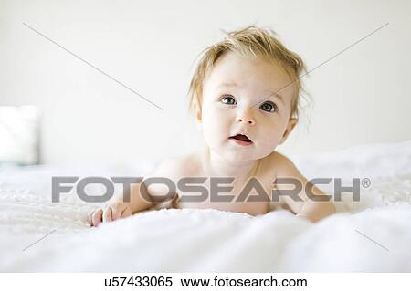 Portrait of baby girl (6-11 Months) with mouth open and tousled hair View Large Photo Image Stock Photography - Portrait of baby girl (6-11 Months) with mouth open and tousled hair. Fotosearch