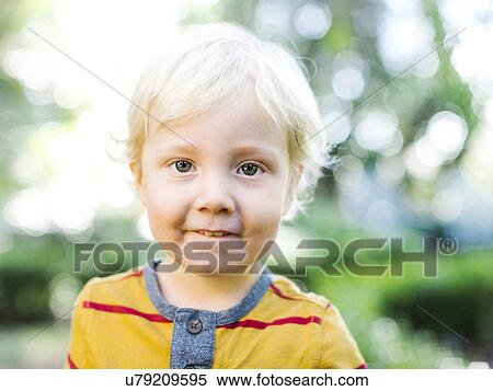 Stock Photography - Portrait of boy (4-5) looking at camera. Fotosearch