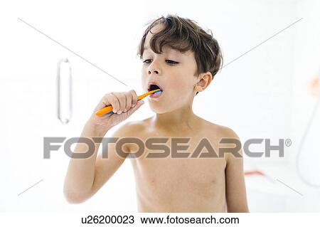 Portrait of boy (6-7 ) brushing teeth View Large Photo Image Stock Image - Portrait of boy (6-7 ) brushing teeth. Fotosearch