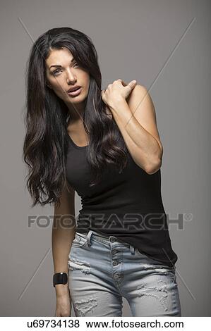 Portrait of brunette woman wearing black tank top View Large Photo Image Stock Photo - Portrait of brunette woman wearing black tank top. Fotosearch
