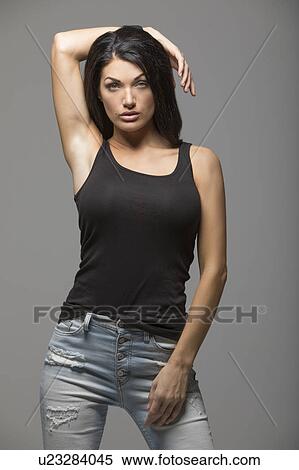 Portrait of brunette woman wearing black tank top View Large Photo Image Stock Photography - Portrait of brunette woman wearing black tank top. Fotosearch