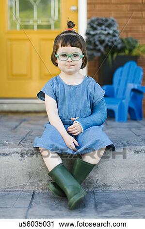 Stock Image - Portrait of girl (2-3) with broken arm. Fotosearch