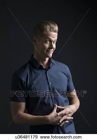 Portrait of man frowning and smiling View Large Photo Image Stock Photo - Portrait of man frowning and smiling. Fotosearch
