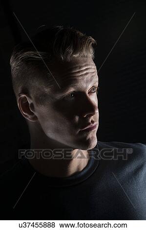 Portrait of man looking away View Large Photo Image Stock Photo - Portrait of man looking away. Fotosearch