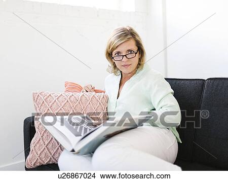 Picture - Portrait of Mature woman reading book. Fotosearch