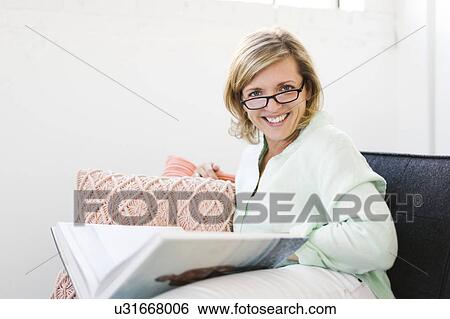 Portrait of Mature woman reading book View Large Photo Image Stock Photograph - Portrait of Mature woman reading book. Fotosearch