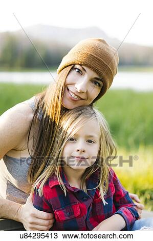 Portrait of mother and son (6-7) in meadow View Large Photo Image Stock Image - Portrait of mother and son (6-7) in meadow. Fotosearch