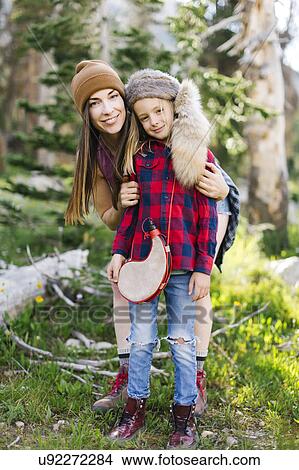 Portrait of mother with son (6-7) hiking in forest View Large Photo Image Picture - Portrait of mother with son (6-7) hiking in forest. Fotosearch