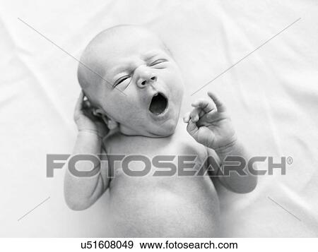 Stock Photo - Portrait of newborn boy ( 0-1 months ) yawning. Fotosearch