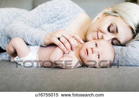 Portrait of newborn boy ( 0-1 months ) with mother View Large Photo Image Stock Photography - Portrait of newborn boy ( 0-1 months ) with mother. Fotosearch