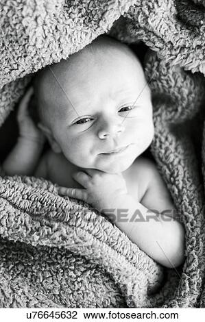 Stock Image - Portrait of one day Baby boy (0-1 months). Fotosearch