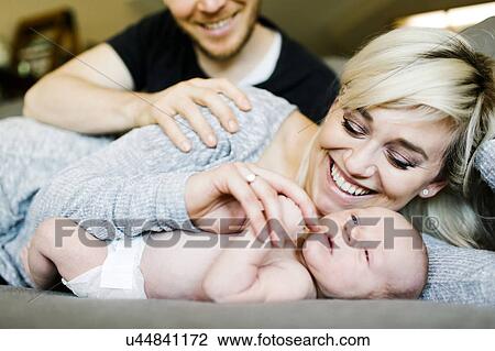 Portrait of parents with newborn boy ( 0-1 months ) View Large Photo Image Stock Image - Portrait of parents with newborn boy ( 0-1 months ). Fotosearch