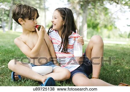 Portrait of sister ( 10-11 ) and brother (6-7 ) having fun on picnic View Large Photo Image Stock Photo - Portrait of sister ( 10-11 ) and brother (6-7 ) having fun on picnic. Fotosearch
