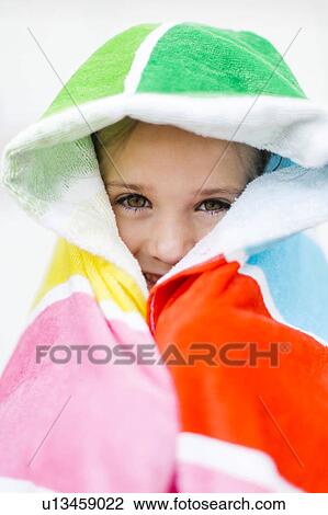 Portrait of smiling girl (4-5) in colorful towel View Large Photo Image Stock Image - Portrait of smiling girl (4-5) in colorful towel. Fotosearch