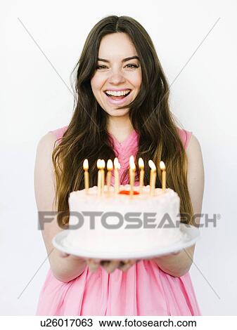 Portrait of woman holding birthday cake View Large Photo Image Stock Image - Portrait of woman holding birthday cake. Fotosearch