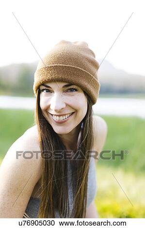 Portrait of woman wearing knit hat View Large Photo Image Stock Image - Portrait of woman wearing knit hat. Fotosearch