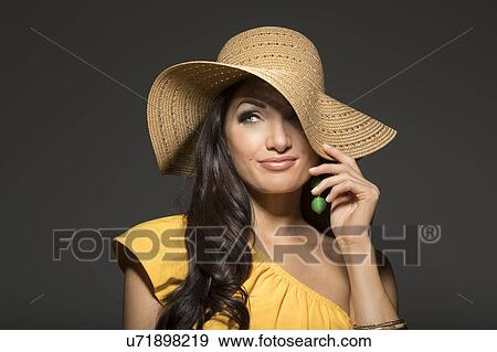 Portrait of woman wearing straw hat and yellow top View Large Photo Image Stock Photo - Portrait of woman wearing straw hat and yellow top. Fotosearch