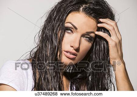 Portrait of woman with wet hair, looking away View Large Photo Image Stock Photo - Portrait of woman with wet hair, looking away. Fotosearch