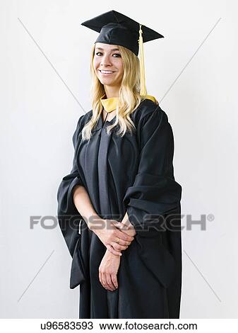 Portrait of young blond woman wearing graduation gown View Large Photo Image Stock Image - Portrait of young blond woman wearing graduation gown. Fotosearch