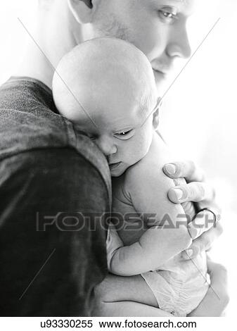 Portrait one day baby boy (0-1 months) being hold by his father View Large Photo Image Stock Photography - Portrait one day baby boy (0-1 months) being hold by his father. Fotosearch