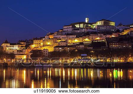 Stock Photography - Portugal, Centro Region, Coimbra, Panorama of Coimbra across Mondego River. Fotosearch