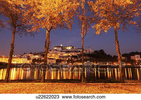 Stock Image - Portugal, Coimbra, Panorama of Coimbra across Mondego River. Fotosearch