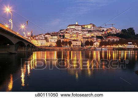 Stock Image - Portugal, Coimbra, Panorama of Coimbra across Mondego River. Fotosearch