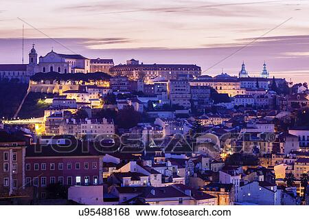 Stock Photo - Portugal, Lisbon, Panorama of city at sunrise. Fotosearch