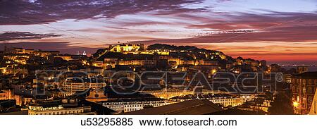 Stock Photography - Portugal, Lisbon, Saint George's Castle above Old Town in Lisbon at dusk. Fotosearch