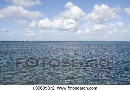 Stock Image - Puerto Rico, Rio Grande, Puffy clouds over Atlantic Ocean. Fotosearch