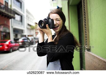 Puerto Rico, San Juan, Woman standing on street and photographing View Large Photo Image Stock Photo - Puerto Rico, San Juan, Woman standing on street and photographing. Fotosearch