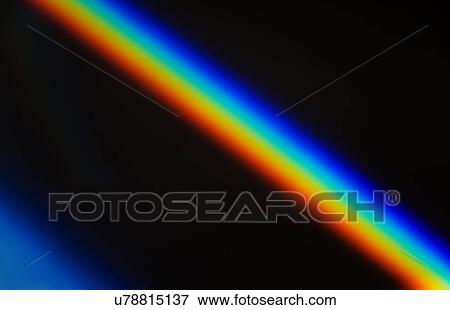 Stock Photo - Rainbow light against black. Fotosearch