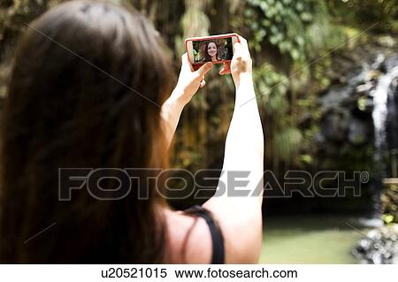 Saint Lucia, Woman taking selfie in front of waterfalls View Large Photo Image Stock Photography - Saint Lucia, Woman taking selfie in front of waterfalls. Fotosearch