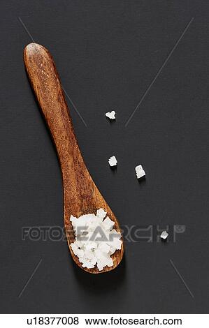 Sea salt on wooden spoon View Large Photo Image Stock Photo - Sea salt on wooden spoon. Fotosearch
