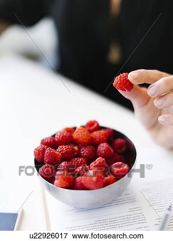 Selective focus on bowl with raspberries View Large Photo Image Stock Photo - Selective focus on bowl with raspberries. Fotosearch