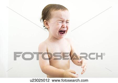 Stock Image - Shirtless boy (4-5) crying. Fotosearch