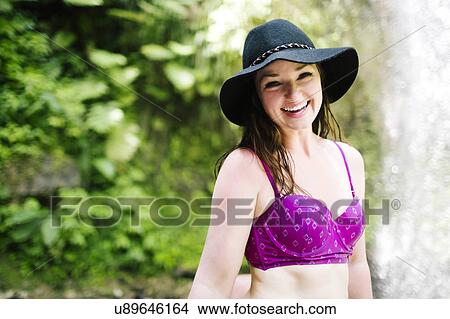 Smiling woman wearing hat View Large Photo Image Picture - Smiling woman wearing hat. Fotosearch
