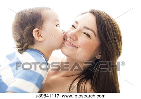 Son (4-5) kissing mother View Large Photo Image Stock Photo - Son (4-5) kissing mother. Fotosearch