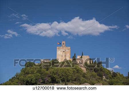 Stock Photo - Spain, Andalusia, Granada, Palace of Alhambra on hill. Fotosearch