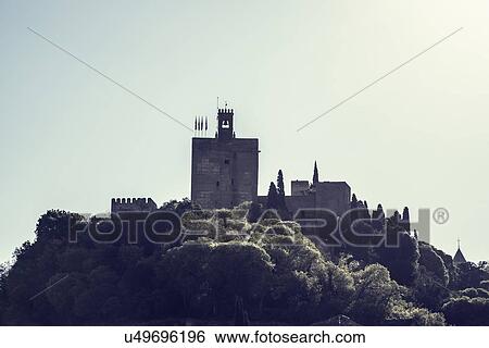 Stock Photograph - Spain, Andalusia, Granada, Palace of Alhambra on hill. Fotosearch