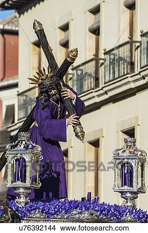 Picture - Spain, Andalusia, Granada, Plaza Nueva, Statue of Jesus Christ carrying cross during Stations of Cross. Fotosearch